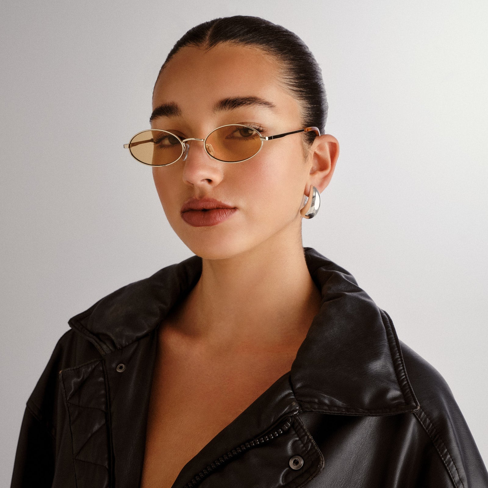 Love Train Gold Female Oval Sunglasses | Le Specs