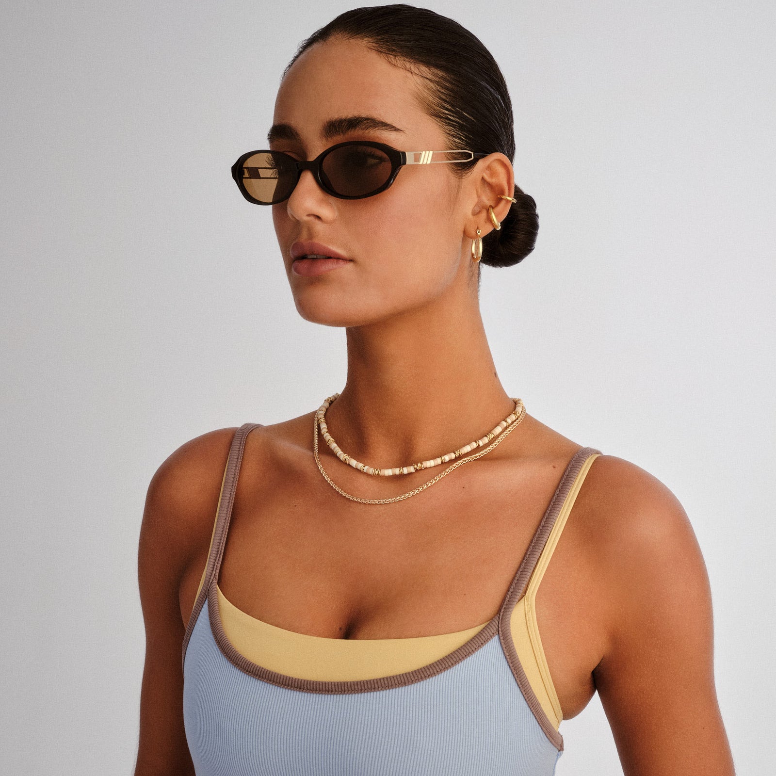 Lunita Black Female Oval Sunglasses | Le Specs